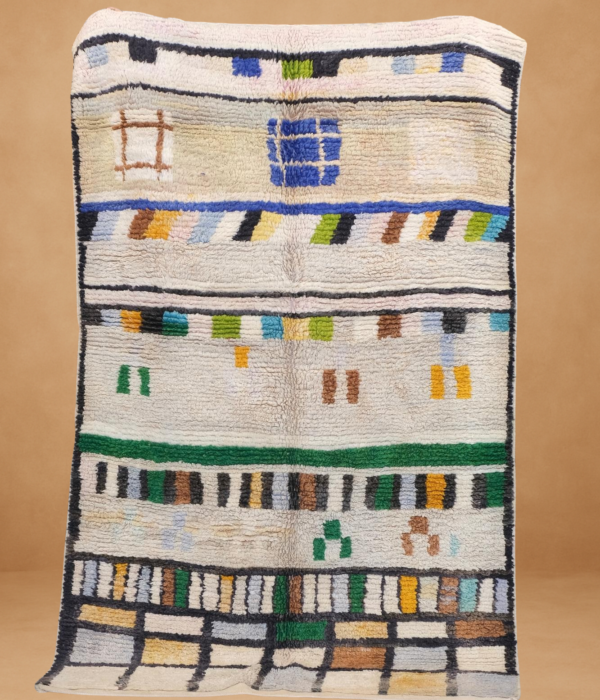 Modern Boujad rug with colorful abstract blocks and lines on a cream base.