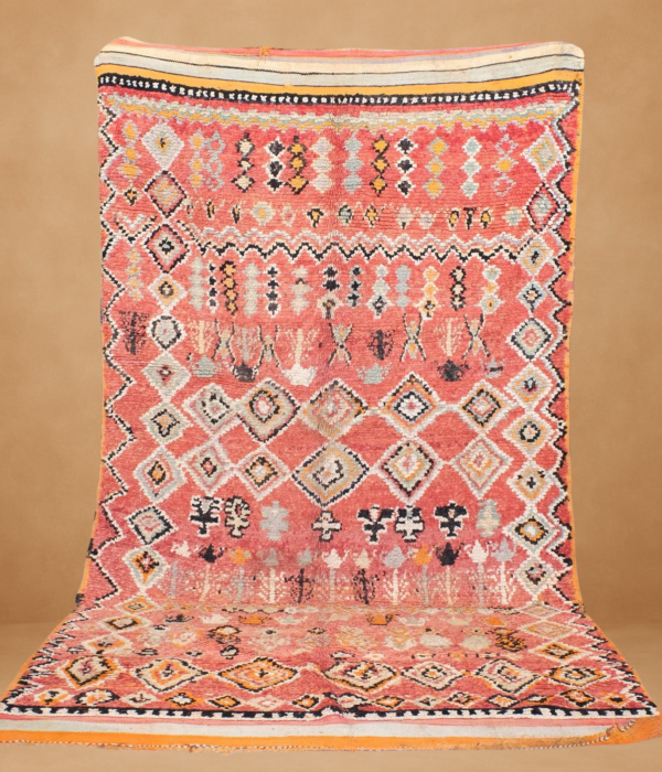 Traditional Beni Mguild rug with rich coral tones and intricate geometric patterns.