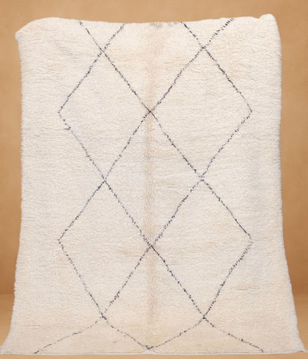Elegant Boujad rug with a cream base and subtle diamond patterns.