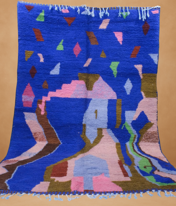 Vivid Boujad rug with bold blue, pink, and brown tones in abstract patterns.