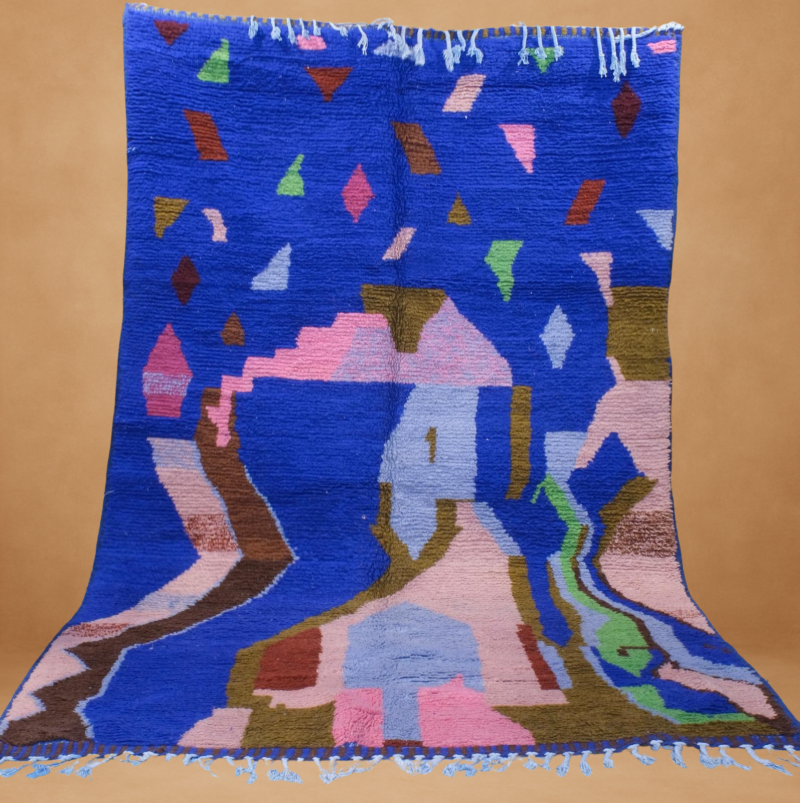 Vivid Boujad rug with bold blue, pink, and brown tones in abstract patterns.