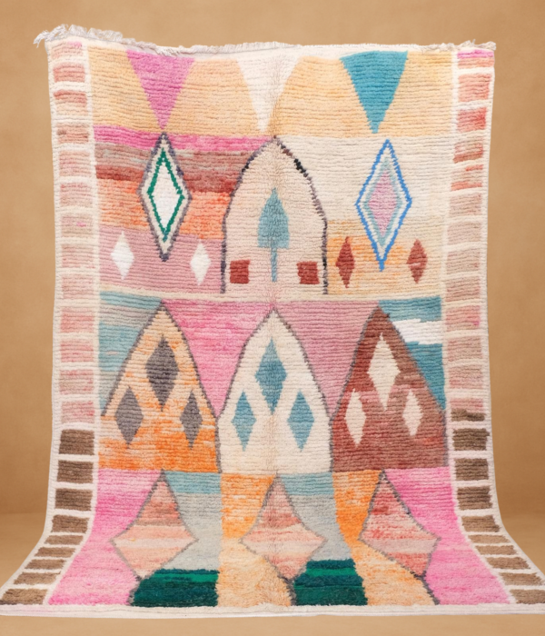 Minimalist Boujad rug with a cream base and delicate diamond patterns.