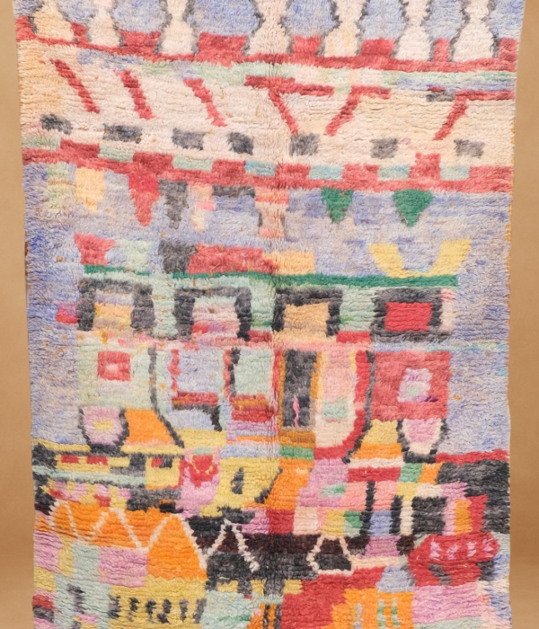 Vibrant Boujad rug with a kaleidoscope of pastel colors and tribal motifs.