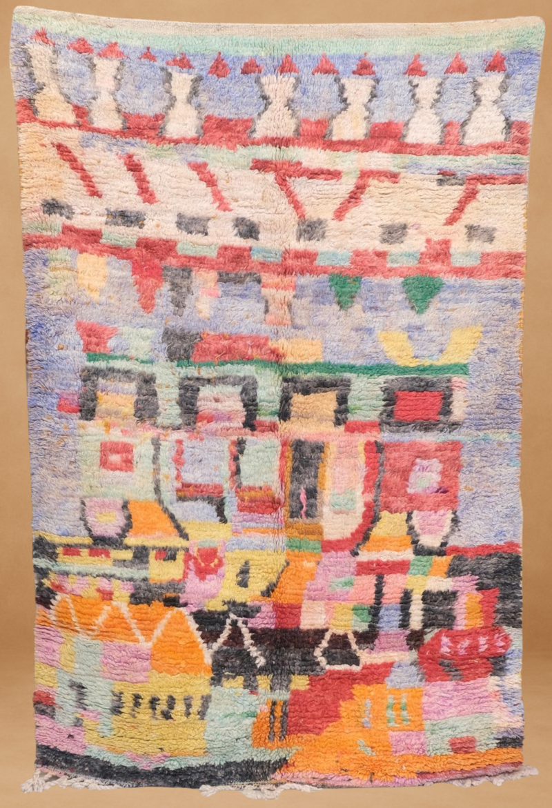Vibrant Boujad rug with a kaleidoscope of pastel colors and tribal motifs.