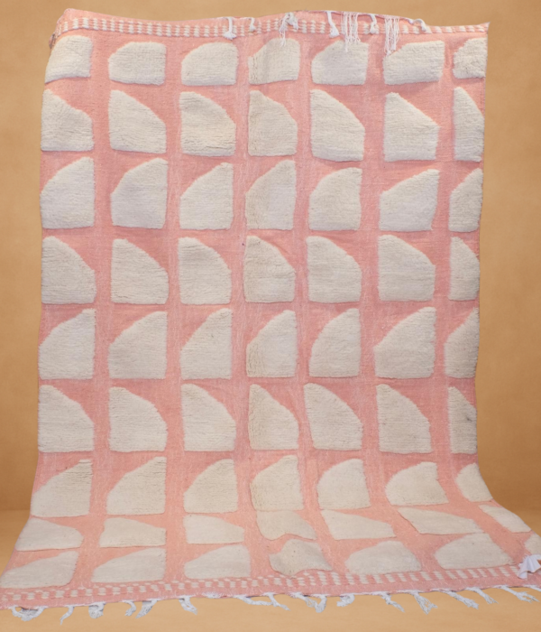 Soft Beni Werin rug in blush pink and cream, featuring a modern geometric pattern.