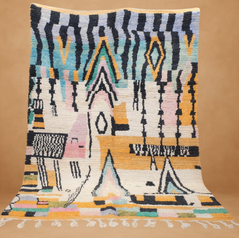 Bright Boujad rug featuring vivid tribal motifs in yellow, black, and pastel tones.